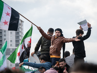 Syrian refugees living in the Onder district of Ankara, Turkey, celebrate the fall of Syrian President Bashar al-Assad after a rapid rebel o...