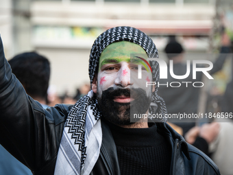 Syrian refugees living in the Onder district of Ankara, Turkey, celebrate the fall of Syrian President Bashar al-Assad after a rapid rebel o...