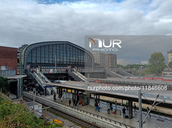 Hamburg Main Station, one of Germany's busiest train stations, showcases a lively scene of commuters and travelers in Hamburg, Germany, on A...