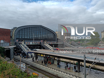 Hamburg Main Station, one of Germany's busiest train stations, showcases a lively scene of commuters and travelers in Hamburg, Germany, on A...