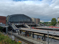 Hamburg Main Station, one of Germany's busiest train stations, showcases a lively scene of commuters and travelers in Hamburg, Germany, on A...