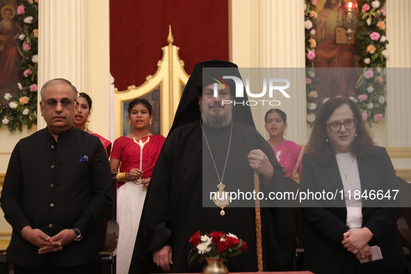 Mr. Raju Bharat, the Warden of the Greek Orthodox Church, Mgr. Konstantinos, H.E. the Metropolitan of Singapore, and Mrs. Aliki Koutsomitopo...