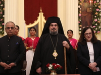 Mr. Raju Bharat, the Warden of the Greek Orthodox Church, Mgr. Konstantinos, H.E. the Metropolitan of Singapore, and Mrs. Aliki Koutsomitopo...