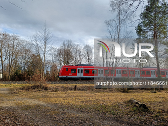 An S-Bahn train of the S6 line travels towards Tutzing in the Munich Metropolitan Area. In Gauting, Bavaria, Germany, on January 2, 2022, a...