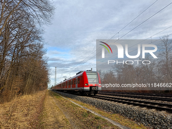 An S-Bahn train of the S6 line travels towards Tutzing in the Munich Metropolitan Area. In Gauting, Bavaria, Germany, on January 2, 2022, a...