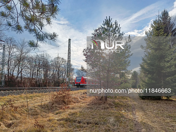 An S-Bahn train of the S6 line travels towards Tutzing in the Munich Metropolitan Area. In Gauting, Bavaria, Germany, on January 2, 2022, a...