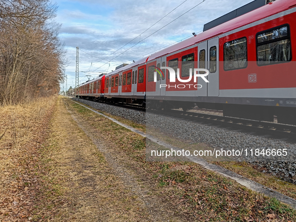 An S-Bahn train of the S6 line travels towards Tutzing in the Munich Metropolitan Area. In Gauting, Bavaria, Germany, on January 2, 2022, a...