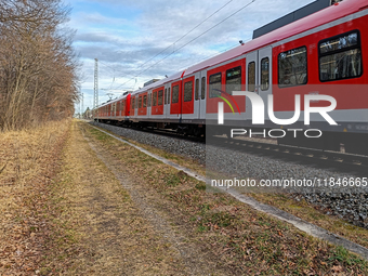 An S-Bahn train of the S6 line travels towards Tutzing in the Munich Metropolitan Area. In Gauting, Bavaria, Germany, on January 2, 2022, a...