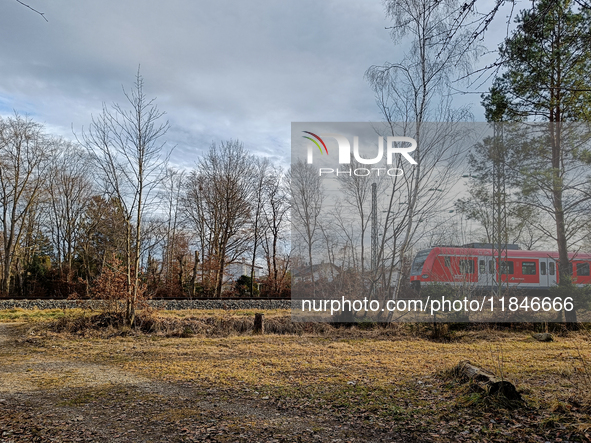 An S-Bahn train of the S6 line travels towards Tutzing in the Munich Metropolitan Area. In Gauting, Bavaria, Germany, on January 2, 2022, a...