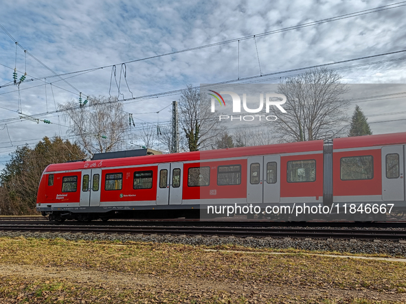 An S-Bahn train of the S6 line travels towards Tutzing in the Munich Metropolitan Area. In Gauting, Bavaria, Germany, on January 2, 2022, a...