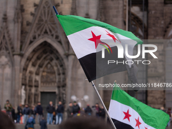 More than a hundred people spontaneously gather in front of Dom Cathedral to celebrate in Cologne, Germany, on December 8, 2024, as the rebe...