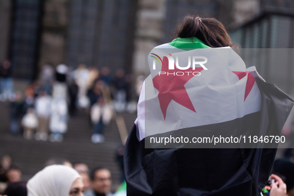 More than a hundred people spontaneously gather in front of Dom Cathedral to celebrate in Cologne, Germany, on December 8, 2024, as the rebe...