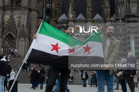 More than a hundred people spontaneously gather in front of Dom Cathedral to celebrate in Cologne, Germany, on December 8, 2024, as the rebe...