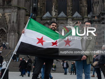 More than a hundred people spontaneously gather in front of Dom Cathedral to celebrate in Cologne, Germany, on December 8, 2024, as the rebe...