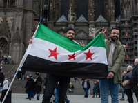 More than a hundred people spontaneously gather in front of Dom Cathedral to celebrate in Cologne, Germany, on December 8, 2024, as the rebe...