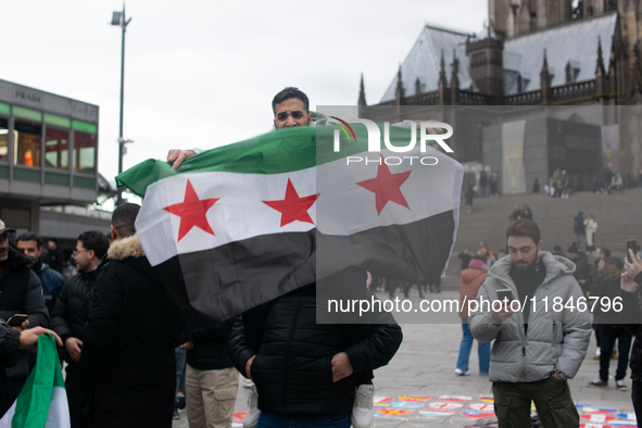 More than a hundred people spontaneously gather in front of Dom Cathedral to celebrate in Cologne, Germany, on December 8, 2024, as the rebe...