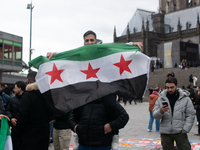 More than a hundred people spontaneously gather in front of Dom Cathedral to celebrate in Cologne, Germany, on December 8, 2024, as the rebe...