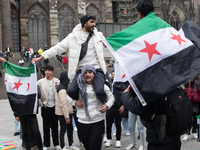 More than a hundred people spontaneously gather in front of Dom Cathedral to celebrate in Cologne, Germany, on December 8, 2024, as the rebe...