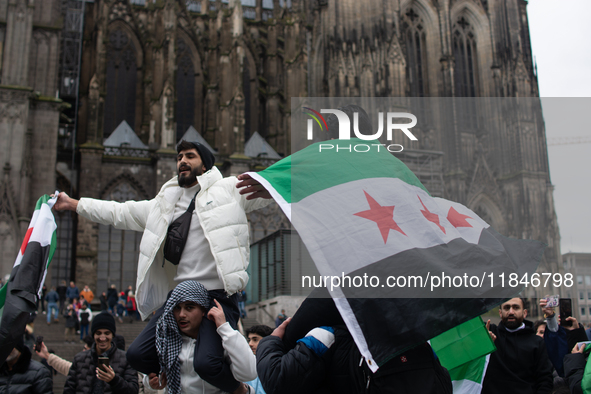 More than a hundred people spontaneously gather in front of Dom Cathedral to celebrate in Cologne, Germany, on December 8, 2024, as the rebe...