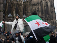 More than a hundred people spontaneously gather in front of Dom Cathedral to celebrate in Cologne, Germany, on December 8, 2024, as the rebe...