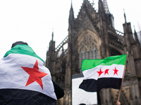 More than a hundred people spontaneously gather in front of Dom Cathedral to celebrate in Cologne, Germany, on December 8, 2024, as the rebe...