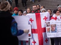 Dozens of people take part in a pro-EU demonstration for Georgia and support the crackdown in Georgia in Cologne, Germany, on December 8, 20...