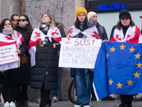 Dozens of people take part in a pro-EU demonstration for Georgia and support the crackdown in Georgia in Cologne, Germany, on December 8, 20...