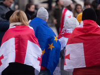 Dozens of people take part in a pro-EU demonstration for Georgia and support the crackdown in Georgia in Cologne, Germany, on December 8, 20...