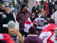 Dozens of people take part in a pro-EU demonstration for Georgia and support the crackdown in Georgia in Cologne, Germany, on December 8, 20...