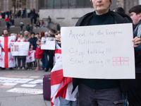 Dozens of people take part in a pro-EU demonstration for Georgia and support the crackdown in Georgia in Cologne, Germany, on December 8, 20...