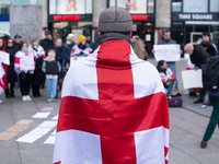 Dozens of people take part in a pro-EU demonstration for Georgia and support the crackdown in Georgia in Cologne, Germany, on December 8, 20...