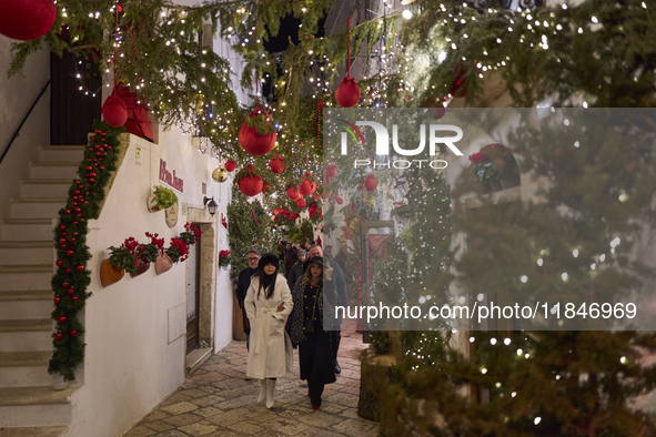 In Locorotondo, Italy, on December 7, 2024, the historic center transforms into a Christmas wonderland. Through self-funding efforts, the vi...