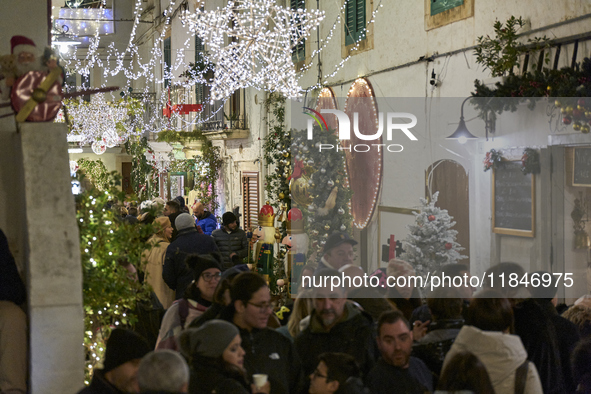 In Locorotondo, Italy, on December 7, 2024, the historic center transforms into a Christmas wonderland. Through self-funding efforts, the vi...