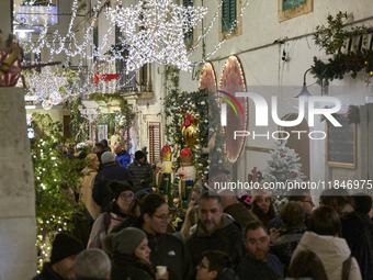 In Locorotondo, Italy, on December 7, 2024, the historic center transforms into a Christmas wonderland. Through self-funding efforts, the vi...