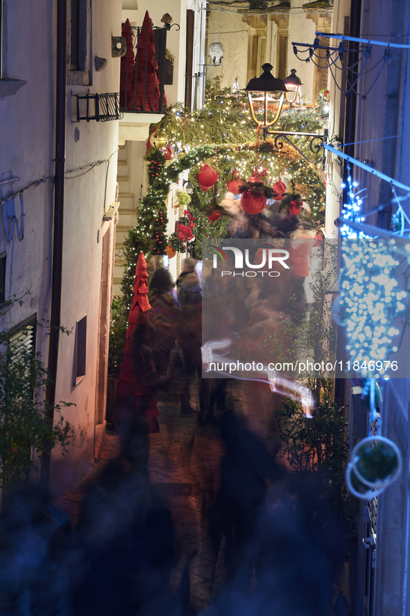 In Locorotondo, Italy, on December 7, 2024, the historic center transforms into a Christmas wonderland. Through self-funding efforts, the vi...