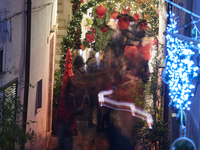 In Locorotondo, Italy, on December 7, 2024, the historic center transforms into a Christmas wonderland. Through self-funding efforts, the vi...