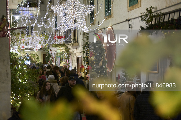 In Locorotondo, Italy, on December 7, 2024, the historic center transforms into a Christmas wonderland. Through self-funding efforts, the vi...