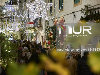 In Locorotondo, Italy, on December 7, 2024, the historic center transforms into a Christmas wonderland. Through self-funding efforts, the vi...