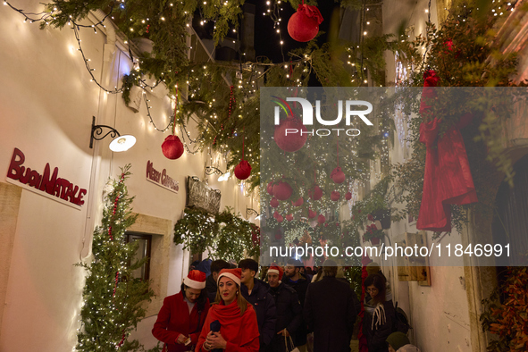 In Locorotondo, Italy, on December 7, 2024, the historic center transforms into a Christmas wonderland. Through self-funding efforts, the vi...