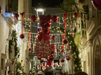 In Locorotondo, Italy, on December 7, 2024, the historic center transforms into a Christmas wonderland. Through self-funding efforts, the vi...