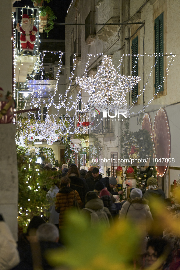 In Locorotondo, Italy, on December 7, 2024, the historic center transforms into a Christmas wonderland. Through self-funding efforts, the vi...