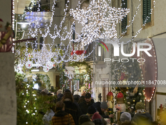 In Locorotondo, Italy, on December 7, 2024, the historic center transforms into a Christmas wonderland. Through self-funding efforts, the vi...