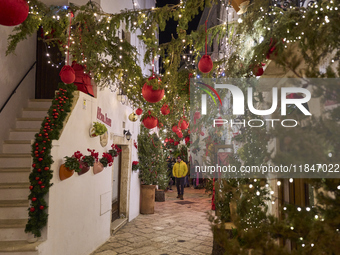 In Locorotondo, Italy, on December 7, 2024, the historic center transforms into a Christmas wonderland. Through self-funding efforts, the vi...