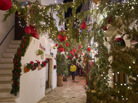 In Locorotondo, Italy, on December 7, 2024, the historic center transforms into a Christmas wonderland. Through self-funding efforts, the vi...