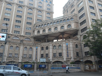 A person passes next to an SBI bank's local head office in Kolkata, India, on December 8, 2024. (