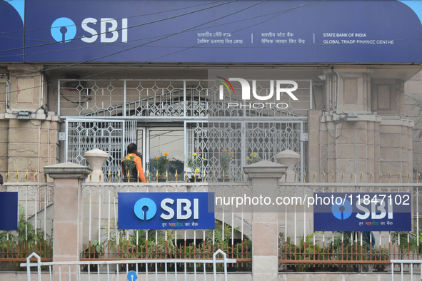 A person enters an SBI bank Global trade finance center in Kolkata, India, on December 8, 2024. 