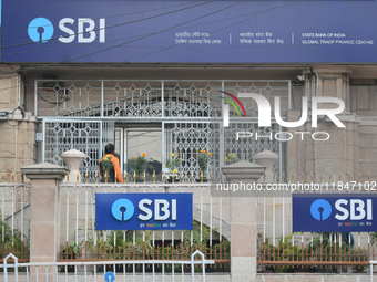 A person enters an SBI bank Global trade finance center in Kolkata, India, on December 8, 2024. (