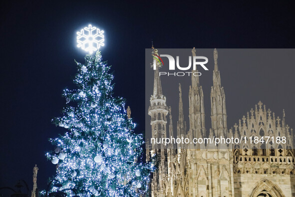 A moment of the lighting ceremony of the Christmas tree of the Olympic and Paralympic Games takes place in Piazza Duomo in Milan, Italy, on...