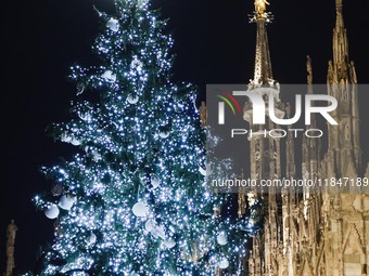 A moment of the lighting ceremony of the Christmas tree of the Olympic and Paralympic Games takes place in Piazza Duomo in Milan, Italy, on...