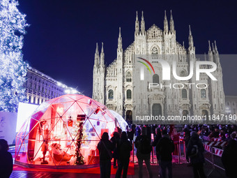 A moment of the lighting ceremony of the Christmas tree of the Olympic and Paralympic Games takes place in Piazza Duomo in Milan, Italy, on...